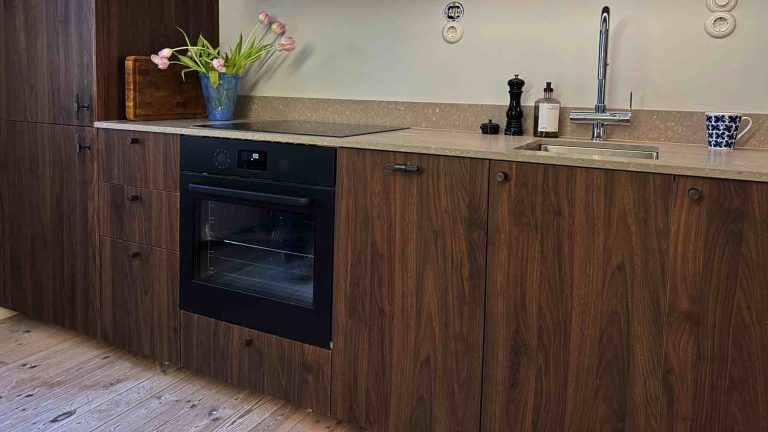Close-up of American walnut IKEA replacement cabinet fronts